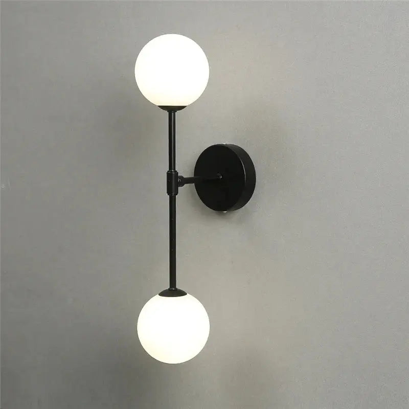 Black metal wall lamp with two frosted golden glass led globes for bedroom decorbites golden glass sconce