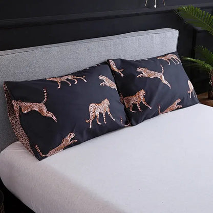 Black pillowcases with gold-toned cheetah pattern as part of black and rose gold leopard print duvet set decorbites Leopard Print