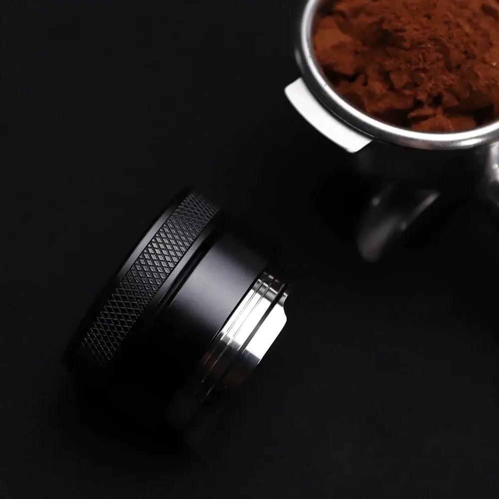 Black aluminum espresso distributor coffee leveler with textured grip and metallic finish for enhanced brewing experience