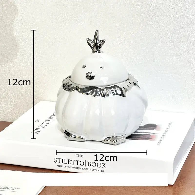 White ceramic garlic duck figurine with silver crown scarf and feet accents for decorbites garlic duck ceramic decor