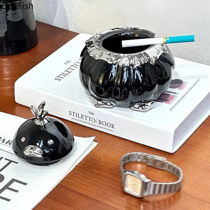 Black and silver garlic duck ceramic pumpkin ashtray with glossy finish and metallic rim for living room decorbites garlic duck decor