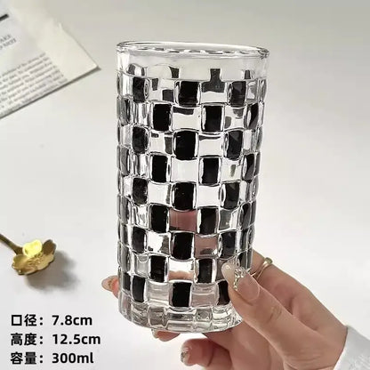 Clear glass cups set with a black and silver mosaic pattern perfect for kitchen drinkware use