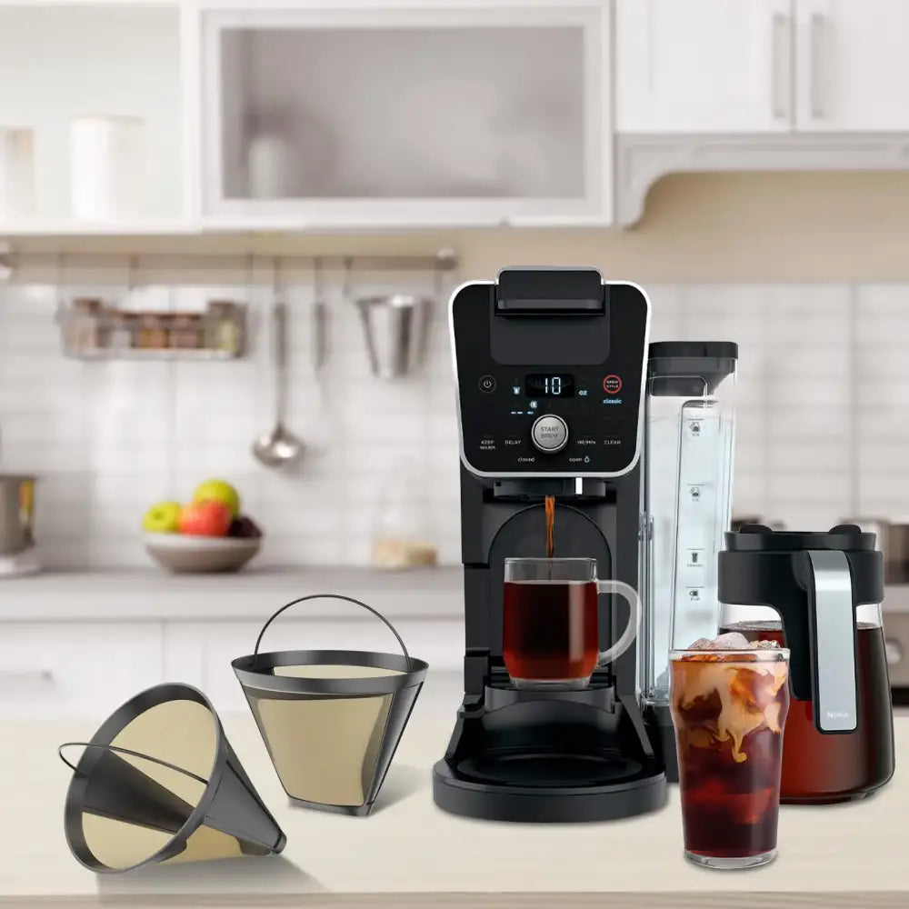 Black and silver nescafé dolce gusto coffee maker with digital display pouring dark brew using decorbites cone coffee filter