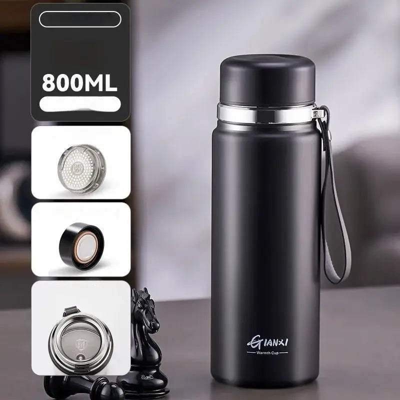 Black and silver stainless steel 24hr cold cup insulated water bottle with silver lid carrying strap and qianxi warmth cup branding