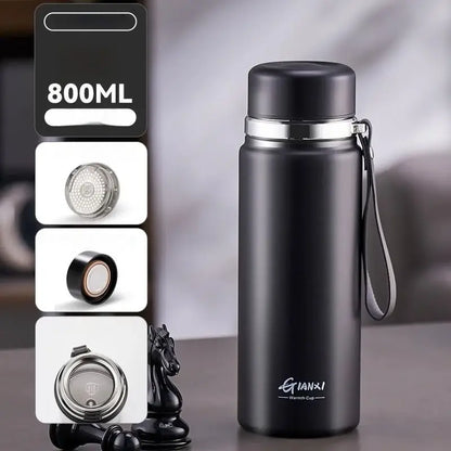 Black and silver stainless steel 24hr cold cup insulated water bottle with silver lid carrying strap and qianxi warmth cup branding