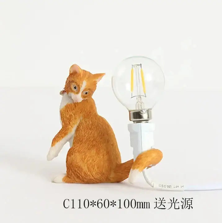 Orange and white cat resin table lamp with glass bulb attached to tail for decorbites cat resin bedroom decor