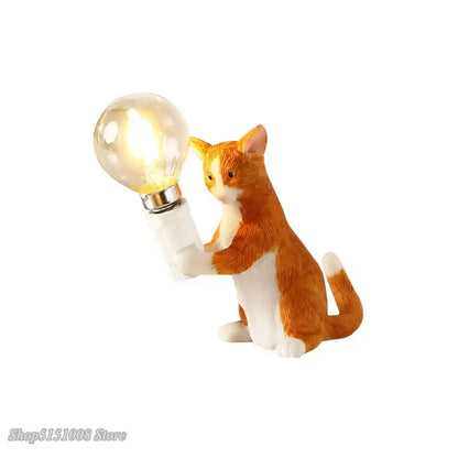 A charming orange and white cat resin table lamp with glowing bulb crafted from detailed resin for decorbites cat resin decor