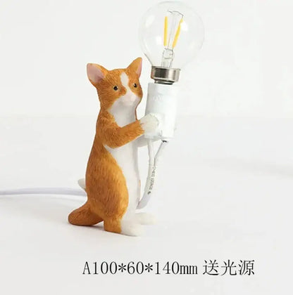 Orange and white cat resin table lamp holding a clear glass bulb designed as decorbites cat resin bedroom decor