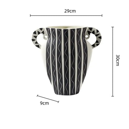 Black and white check geometric ceramic vase with wavy stripes and decorative handles for living room floral display