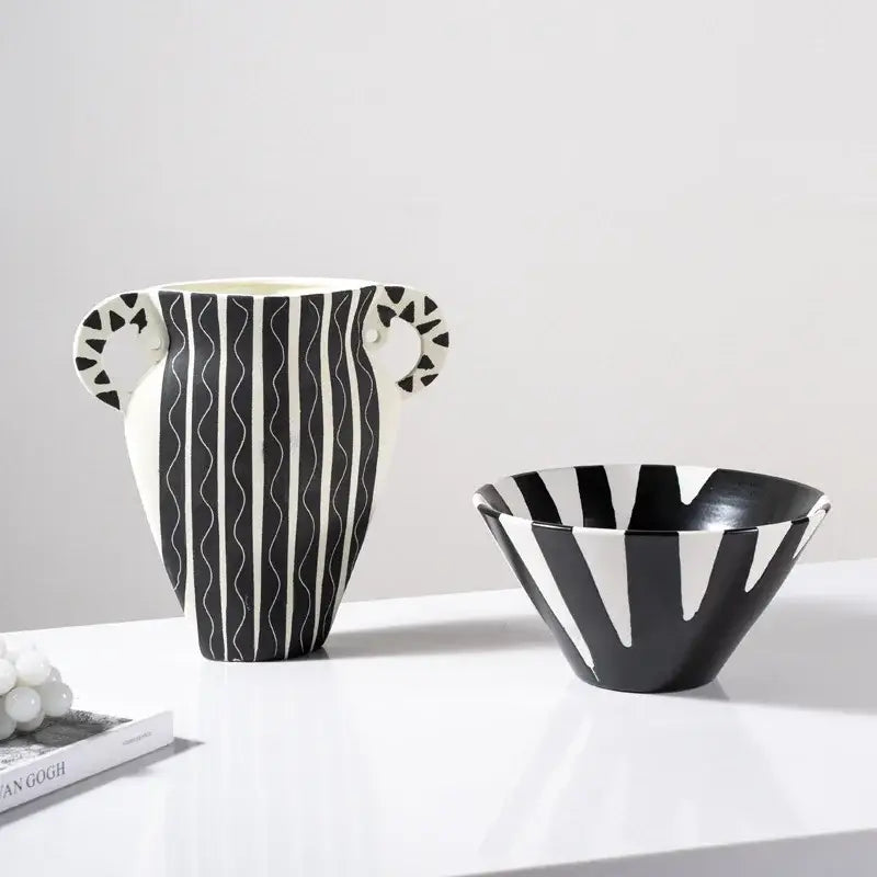 A sleek black and white check geometric ceramic vase with wavy stripes and patterned handles for living room decor