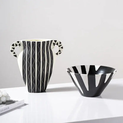 A sleek black and white check geometric ceramic vase with wavy stripes and patterned handles for living room decor