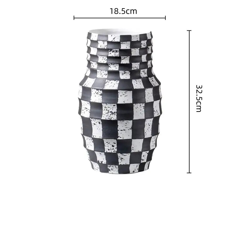 A black and white check geometric ceramic vase with a sleek textured pattern for living room floral decor