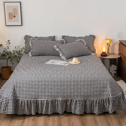 Black and white cotton plaid stripe bedding set featuring a checkered bedspread with a ruffled hem by decorbites