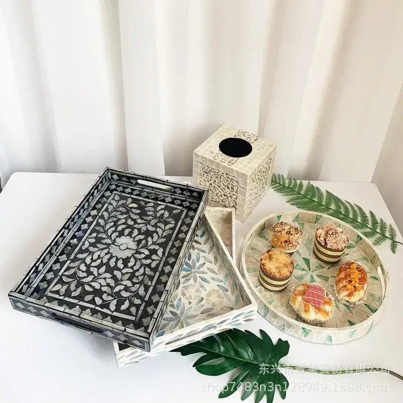Black and white floral mother of pearl tissue box with intricate colorful shell decor for living room use