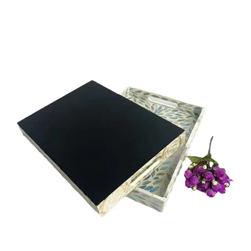 Rectangular serving tray with integrated handle and muted green and blue leaf pattern for decorbites colorful shell tissue use