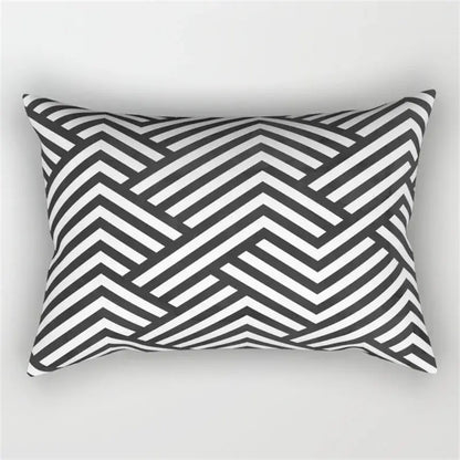 Rectangular pillow with bold black and white geometric wave line chevron pattern for bedroom decor