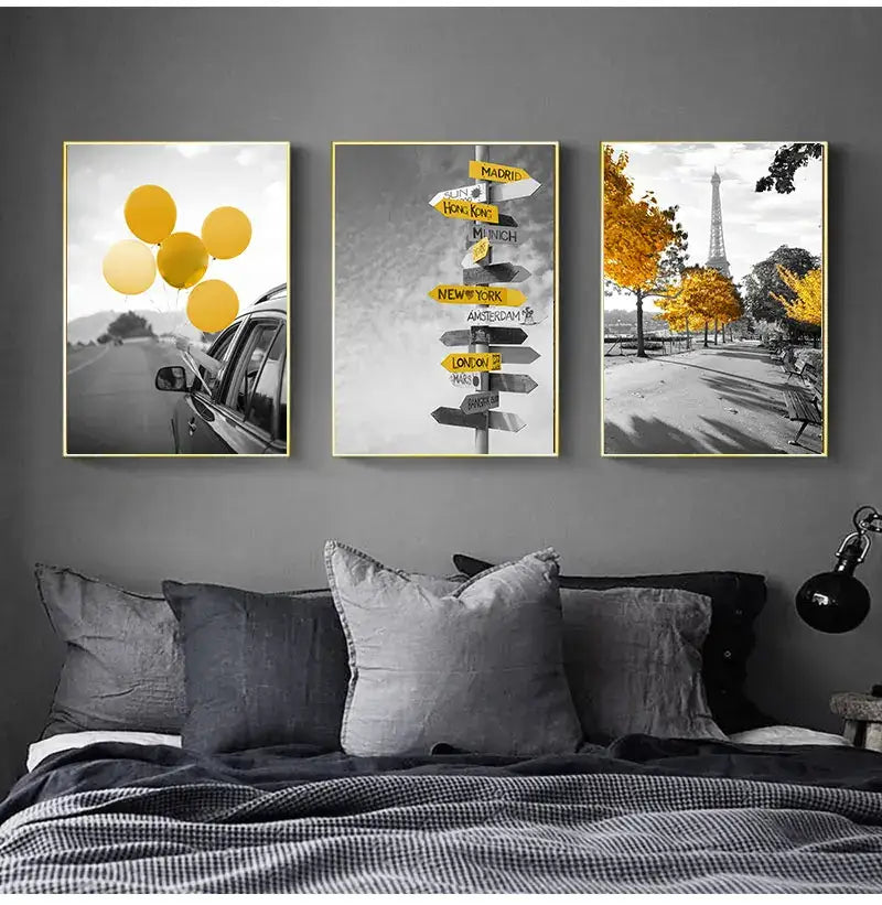 Three framed travel-themed wall art prints with gold frames complement the decorbites™ white nordic landscape canvas set