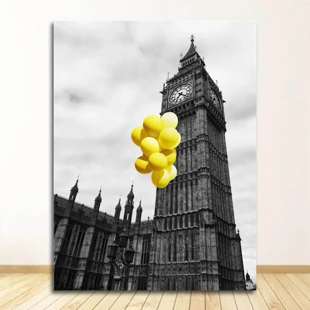 A vibrant cluster of yellow balloons floats in front of the black and white nordic landscape canvas set featuring big ben