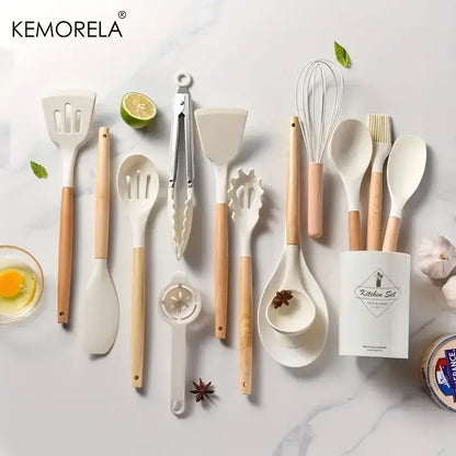 Kemorela silicone kitchen utensil set with white silicone heads, light wood handles, and ceramic spoon rest in kitchen box