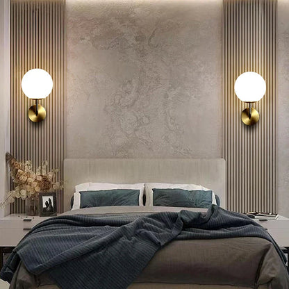 Bedroom with wall sconces.