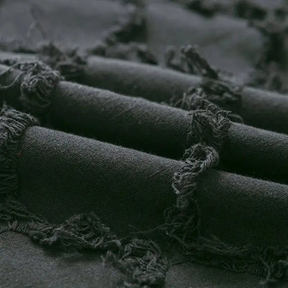 Dark gray textured fabric with frayed edges on decorbites black boho lumbar pillow cover for bedroom decor
