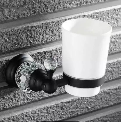 Black and white ceramic toothbrush holder with crystal accents in black brass bathroom accessories set