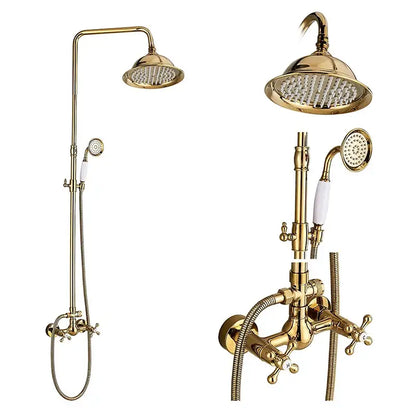 Gold-finished brass shower mixer tap with tall rainhead handheld spray and white ceramic handles for bathroom use