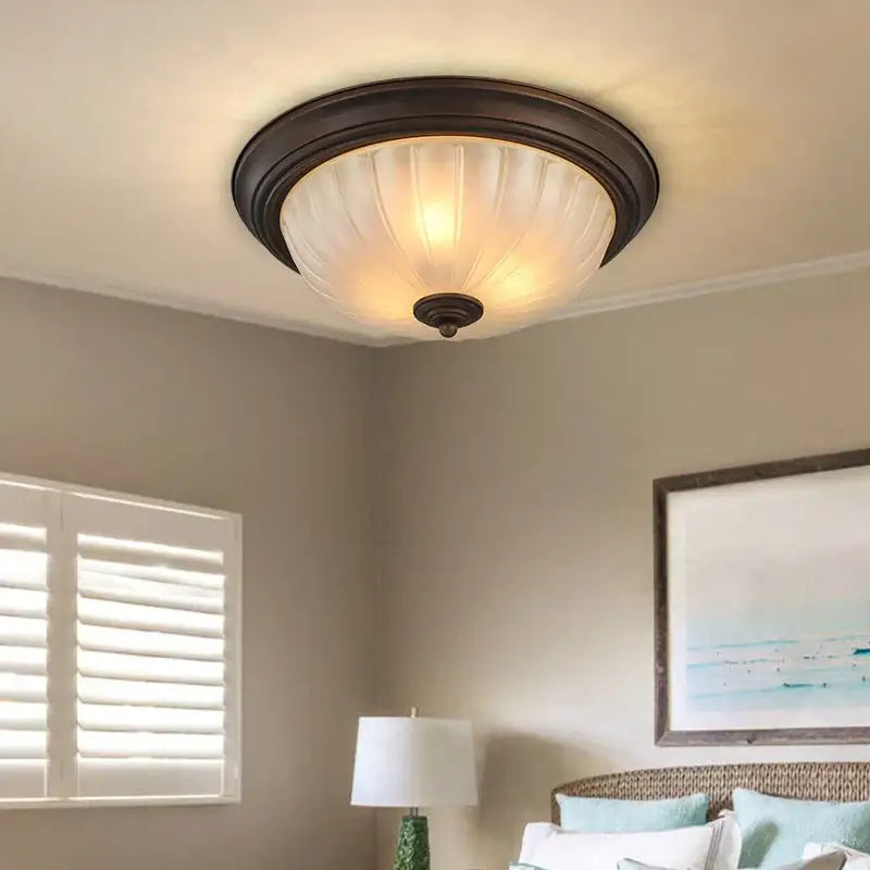 Warm-toned black bronze ceiling light with ribbed opalescent glass shade by decorbites for kitchen and bedroom decor