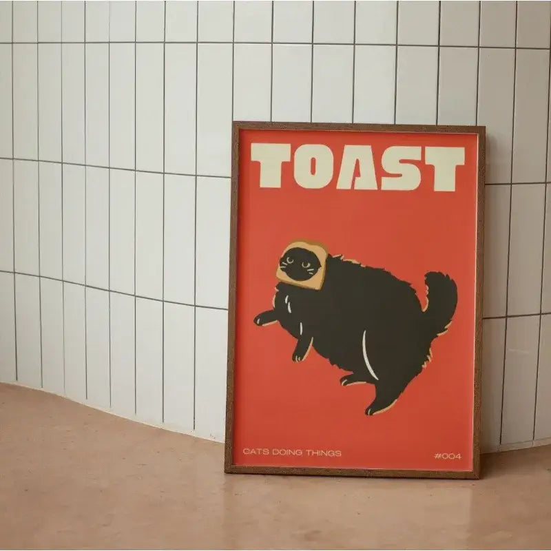 A DecorBites black cat funny animal wall art canvas with a bold red background and toast hat design