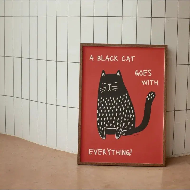 A framed decorbites™ black cat funny animal wall art canvas with a bold red background and white polka dots