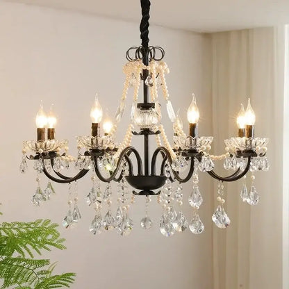 Black crystal chandelier with pearls featuring black wrought iron and clear crystal droplets by decorbites black crystal