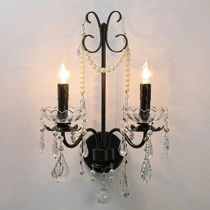 Black wrought iron decorbites black crystal chandelier with two candle bulbs, crystal teardrops, and pearl strands foyer pendant light