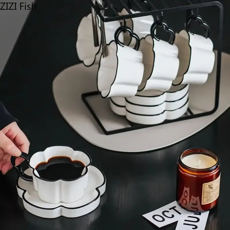 White ceramic coffee cup with black edged flower rim and handle petal shaped mug set for kitchen use