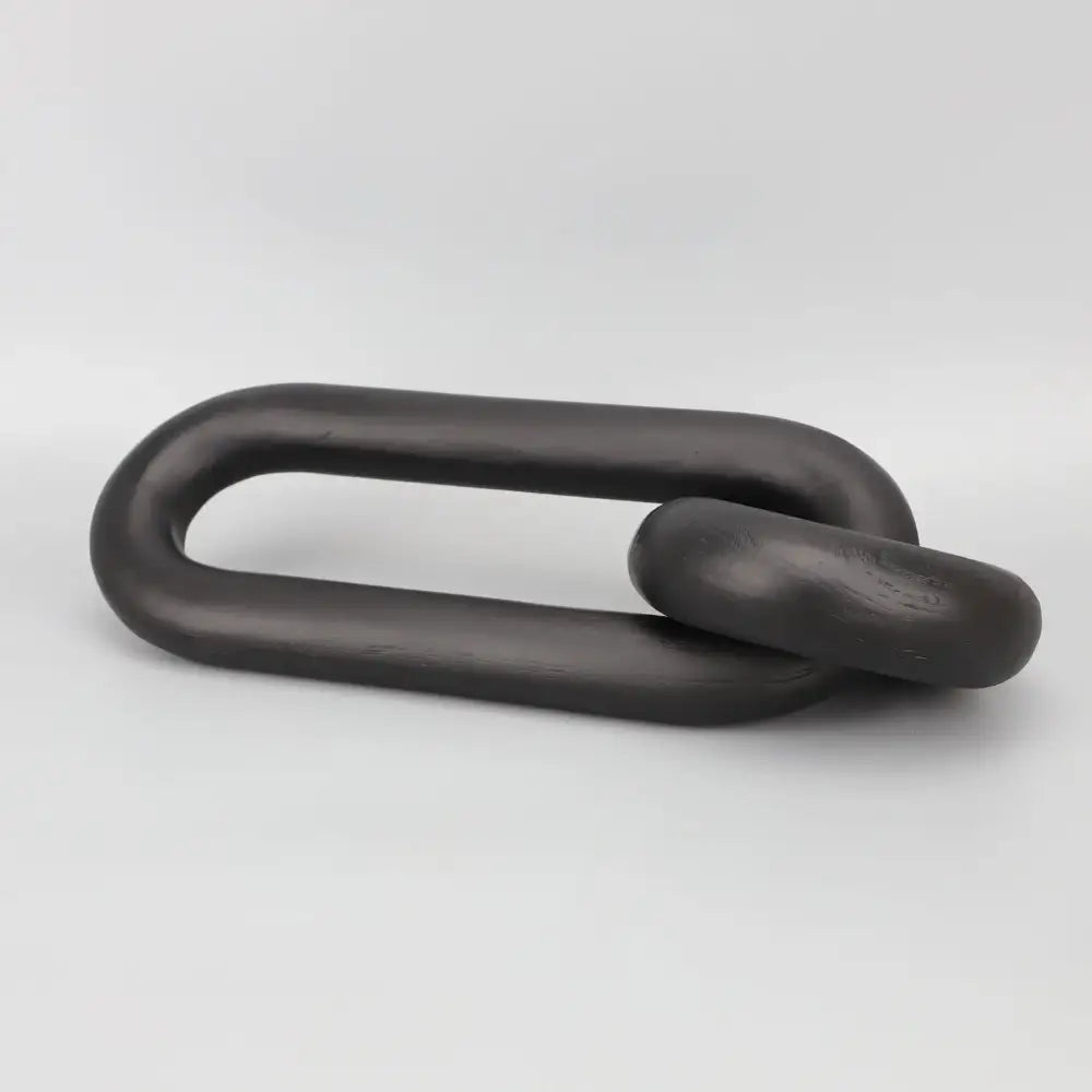 Black geometric resin ornament featuring a matte-finished metal chain link with smooth rounded design for living room decorbites decor