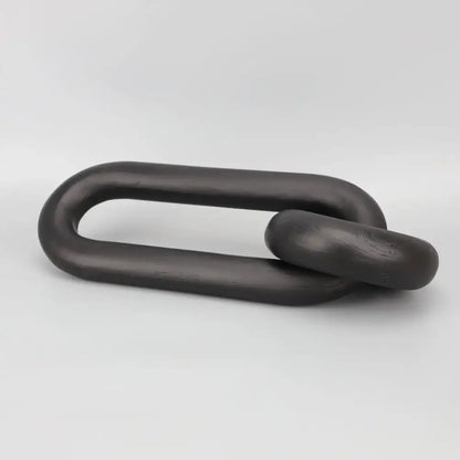 Black geometric resin ornament featuring a matte-finished metal chain link with smooth rounded design for living room decorbites decor