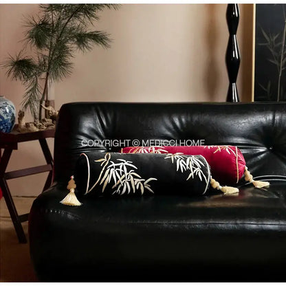 Black cylindrical bolster pillow cover with white bamboo leaves embroidery and cream tassels for bedroom decor
