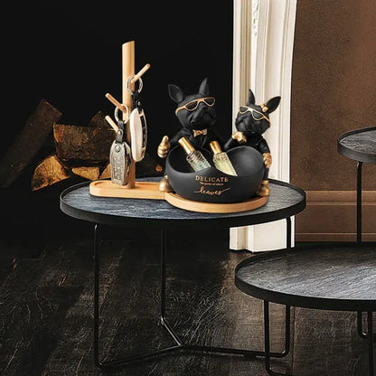 Black and gold french bulldog butler statue with sunglasses holding bottles in a matching bowl office desk organizer