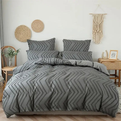 Gray duvet cover with black embroidered zigzag stripe flower cut pattern in a black and gray bedroom set