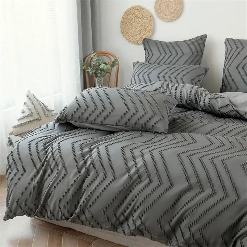 Gray duvet cover set featuring a textured chevron pattern in dark gray thread from black and gray zigzag stripe flower cut collection
