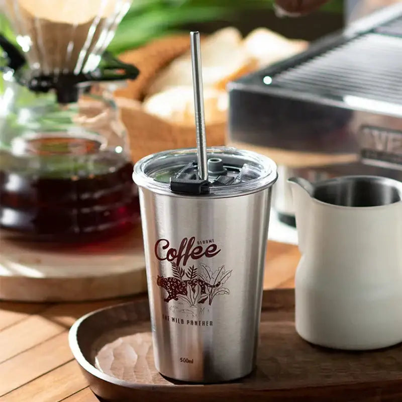 A sleek black insulated stainless steel bubble tea tumbler with clear lid straw and brown panther coffee logo for tea parties