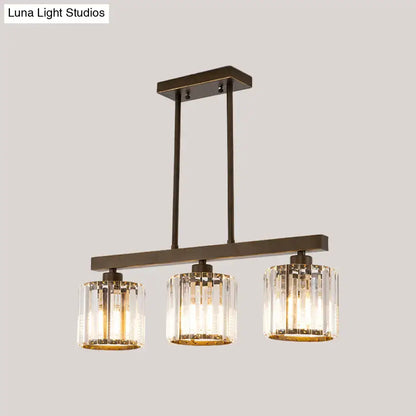 Modern bronze-finished decorbites cylindrical island chandelier with three clear crystal cylindrical shades for dining room
