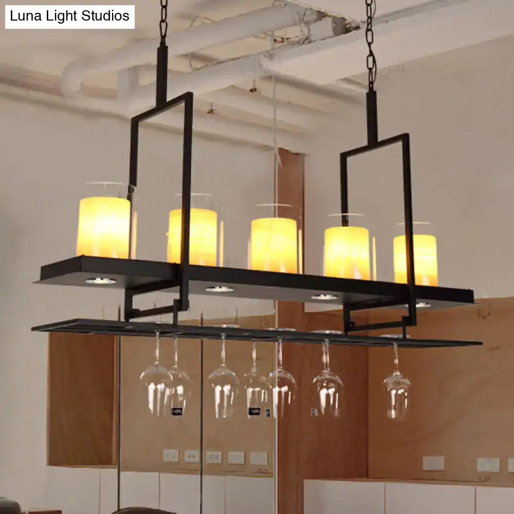 DecorBites black island light fixture with five warm candle bulbs and built-in wine glass rack featuring clear glass cylindrical pendants
