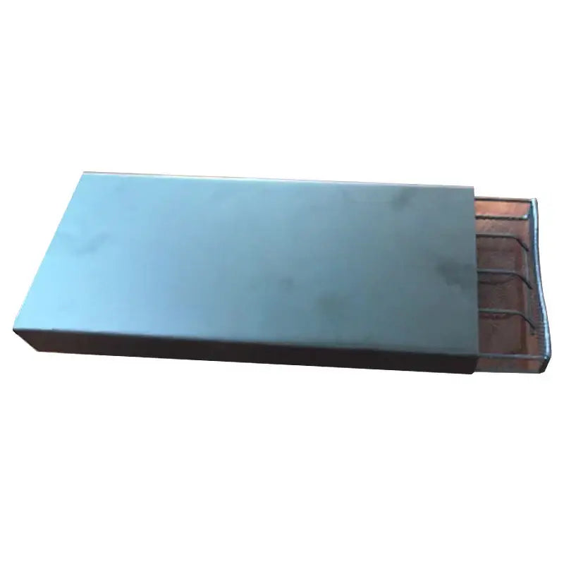 Rectangular metal matchbox with light blue lid and copper interior next to black leather coffee capsule holder stand rack
