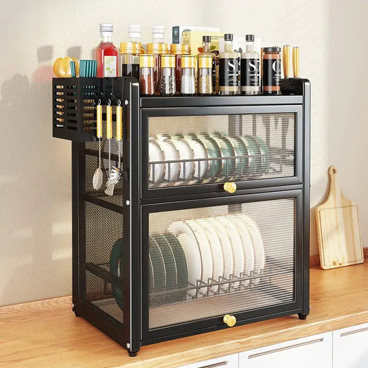 Black mesh double layer dish drying rack with drawers and top shelf holding spice jars and utensils for kitchen storage