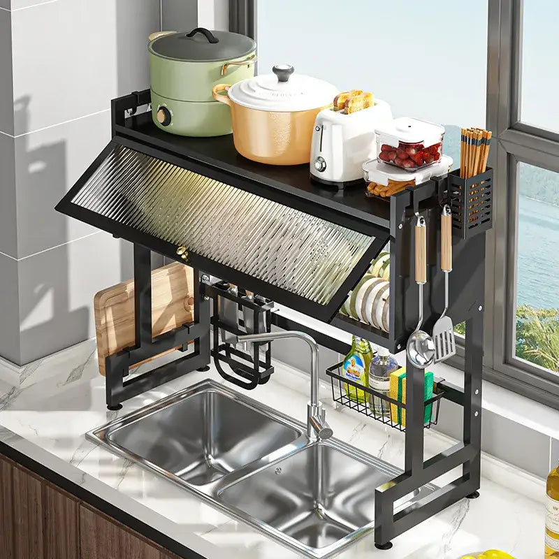 Black metal kitchen cabinet organizer shelf with slanted textured glass panel and multiple compartments for utensils and cookware