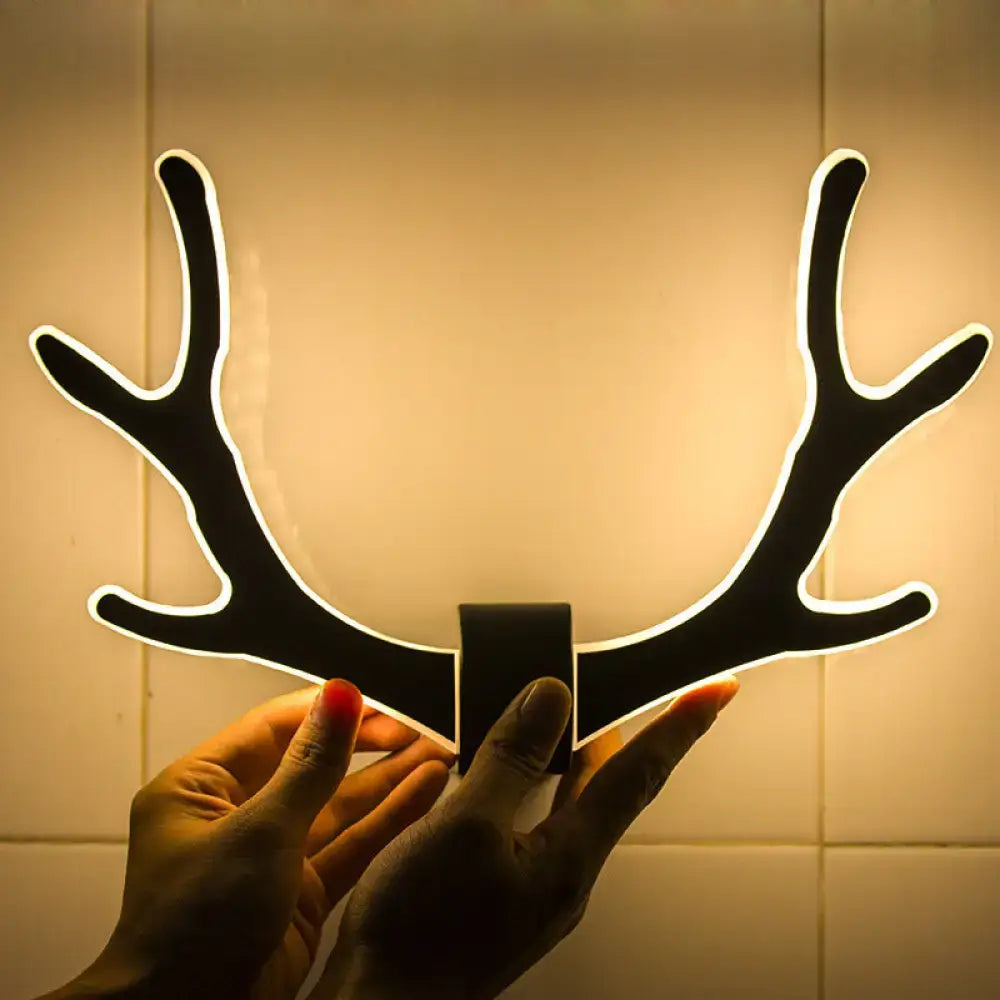 Black metallic antler sconce wall mounted lighting with glowing white outline for bedroom mounted lighting fixture