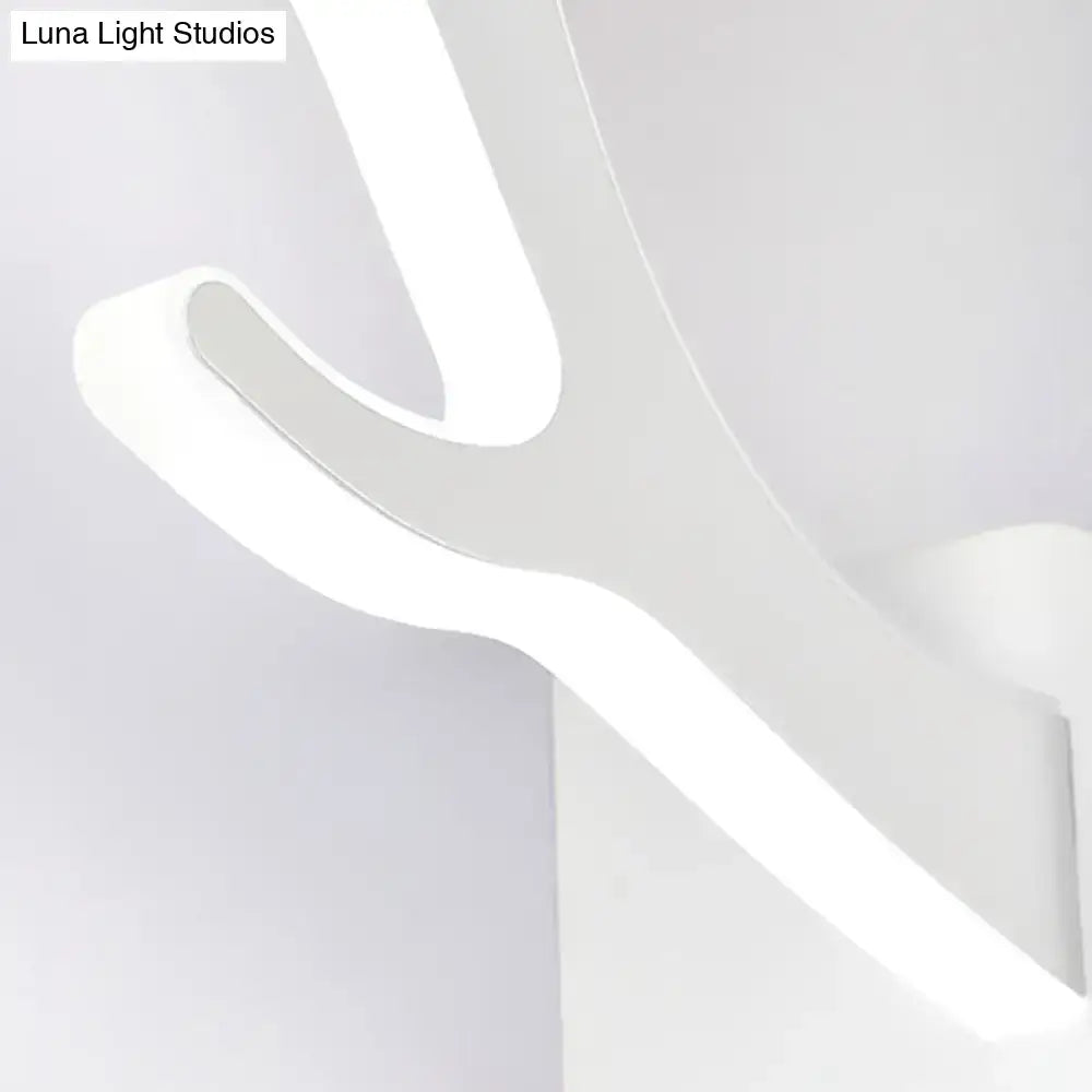 Modern white led wall sconce with sleek curved design as a metallic antler sconce wall mounted lighting fixture for bedroom