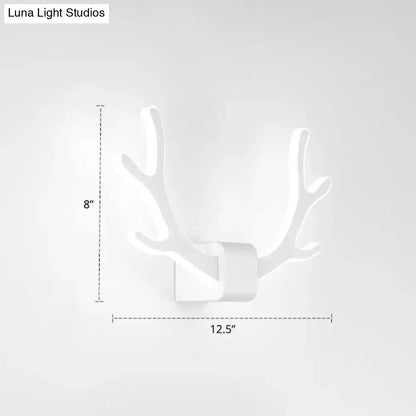 White deer antler-shaped wall mounted lighting fixture featuring black metallic antler sconce for bedroom decor
