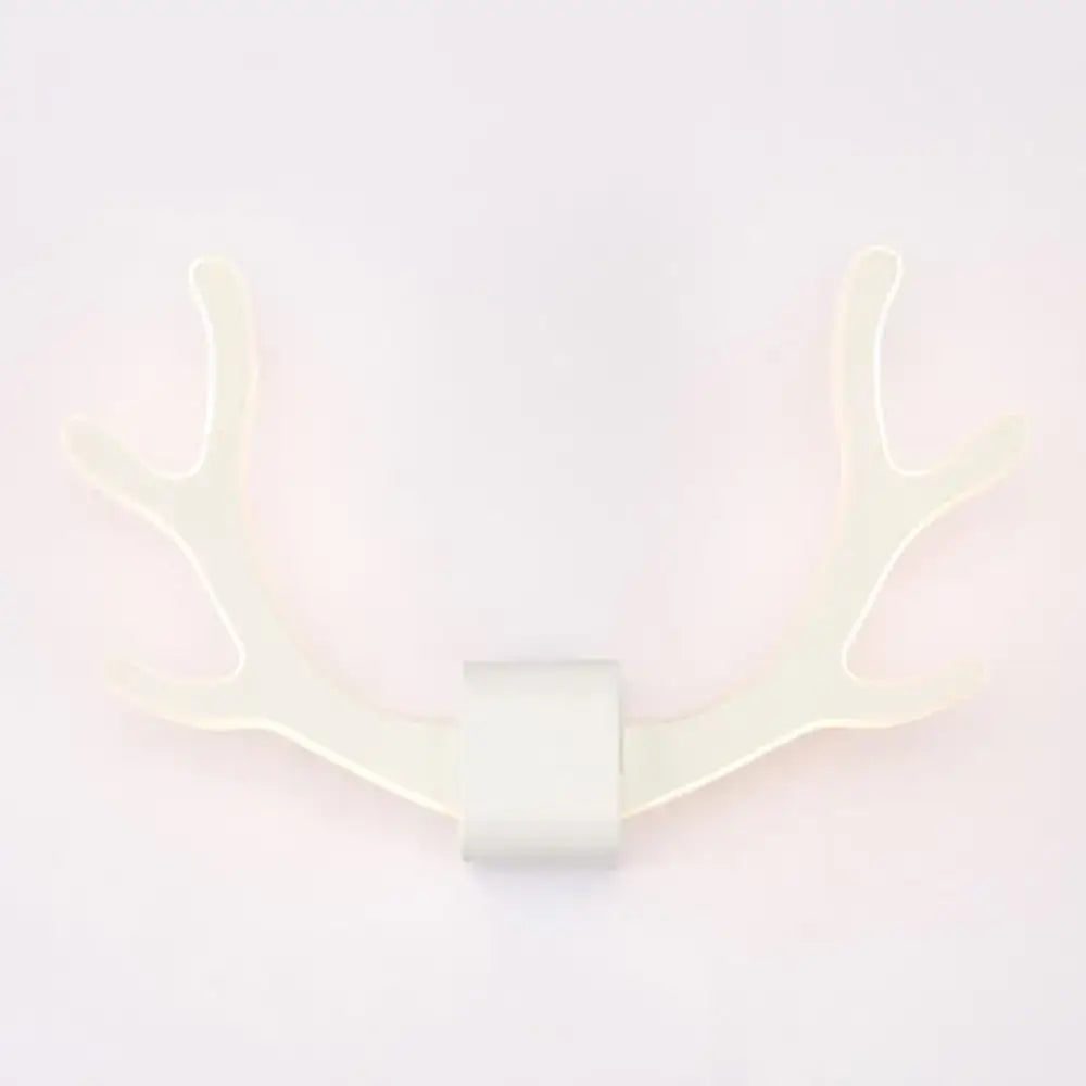 White led wall sconce shaped like deer antlers featuring metallic antler sconce design for bedroom wall mounted lighting