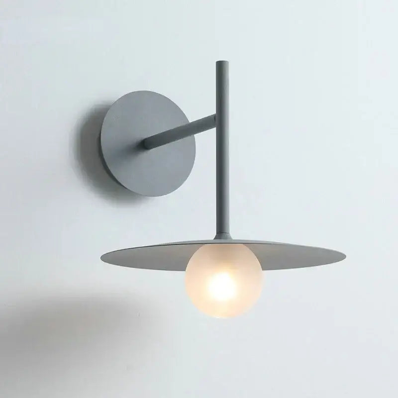 Modern matte gray wall lamp with glass ball wall globe and circular base for minimalist bedroom decorbites glass ball sconce